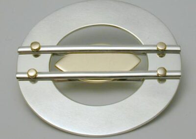 Gold bubble spirit level brooch